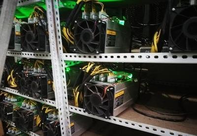 A large-scale Bitcoin mining farm utilizing renewable energy sources.